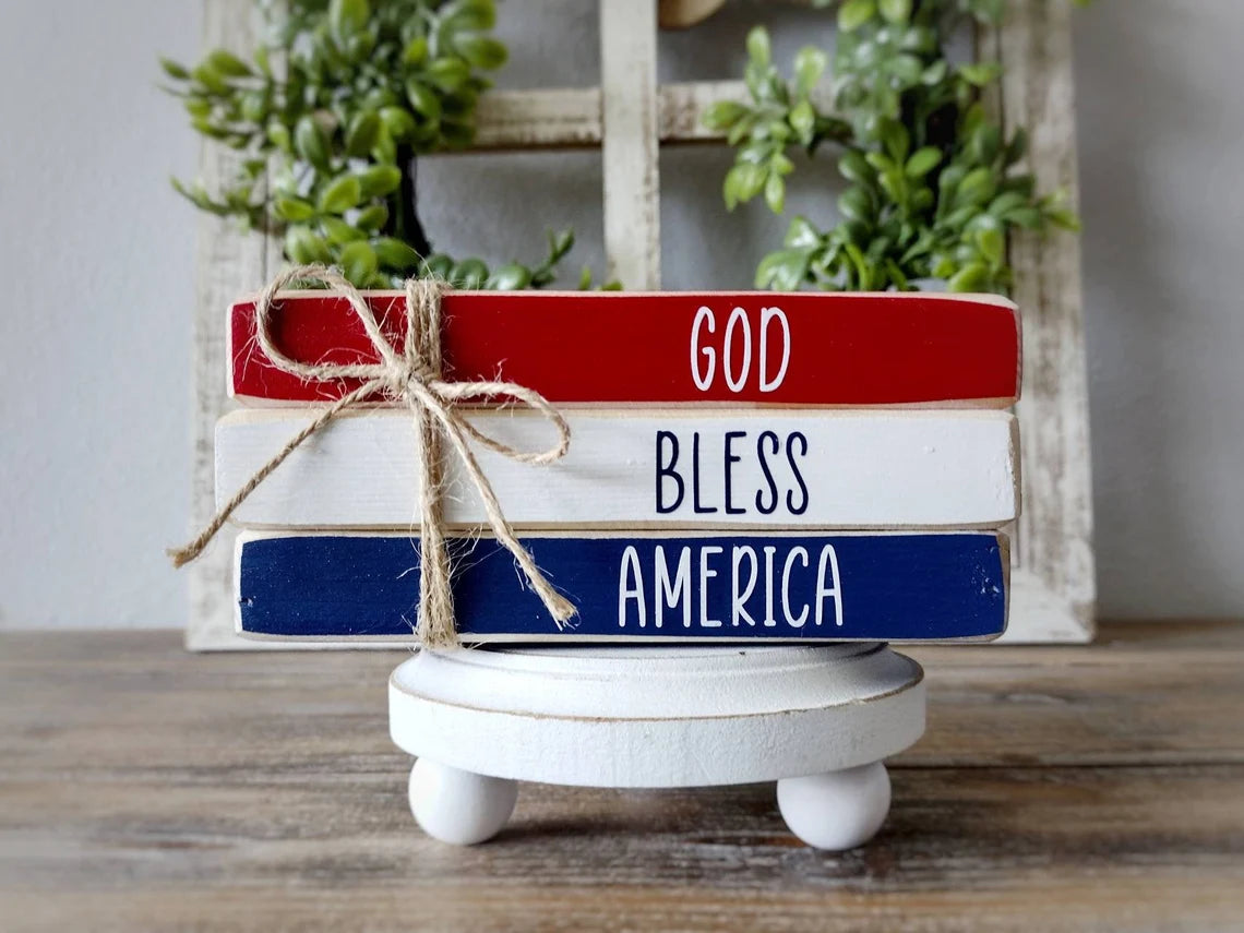 a blue and white sign sitting on a wooden table 