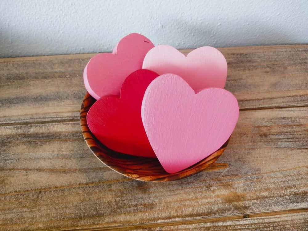 
                  
                    a pink plate with a pink rose on it 
                  
                